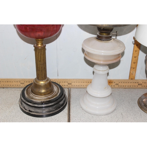 235 - 4 assorted antique and later oil lamps