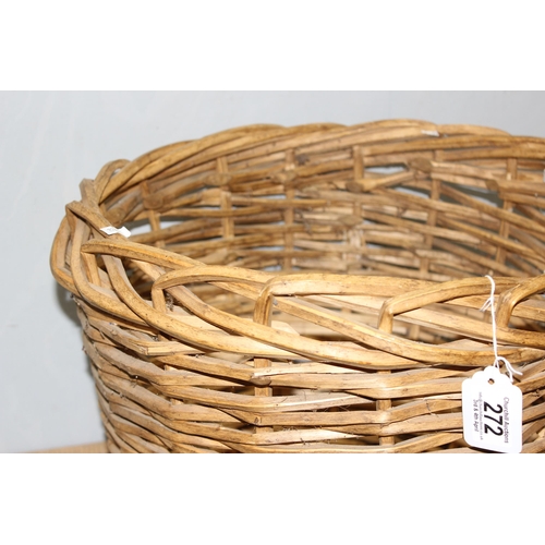 272 - A woven wicker log basket, approx 49cm in diameter