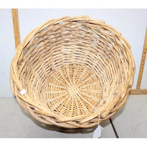 272 - A woven wicker log basket, approx 49cm in diameter