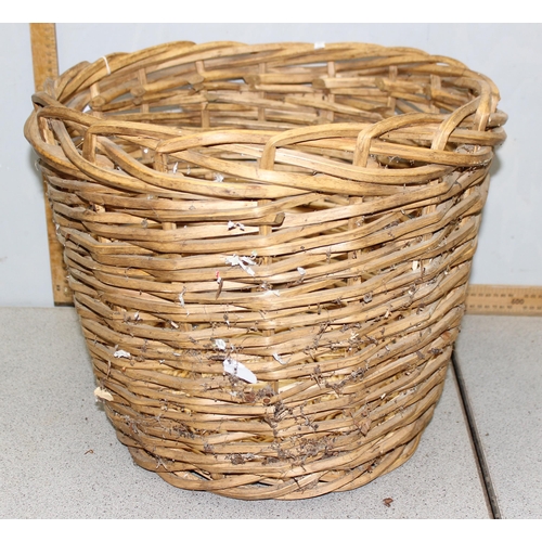 272 - A woven wicker log basket, approx 49cm in diameter