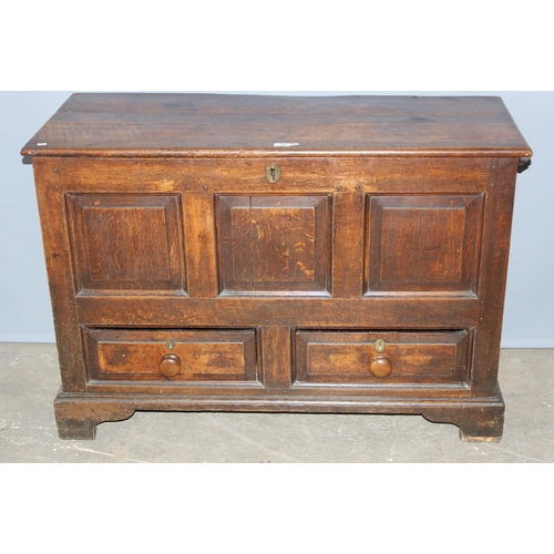 73 - An 18th century oak mule chest comprising of a coffer top over 2 drawers, candle box to interior and... 