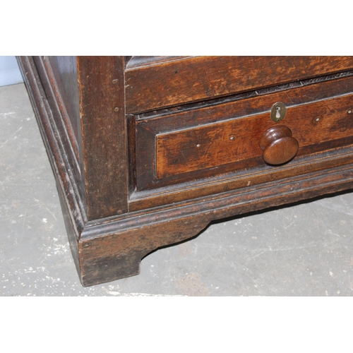 73 - An 18th century oak mule chest comprising of a coffer top over 2 drawers, candle box to interior and... 