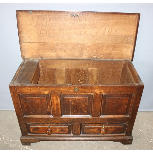 73 - An 18th century oak mule chest comprising of a coffer top over 2 drawers, candle box to interior and... 