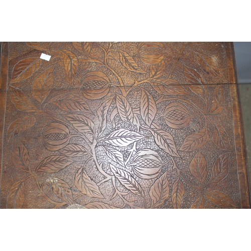 78 - An Arts & Crafts period carved oak table, approx 51cm square