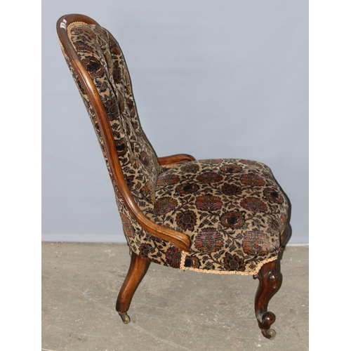 80 - A 19th century mahogany show frame low chair with button upholstery