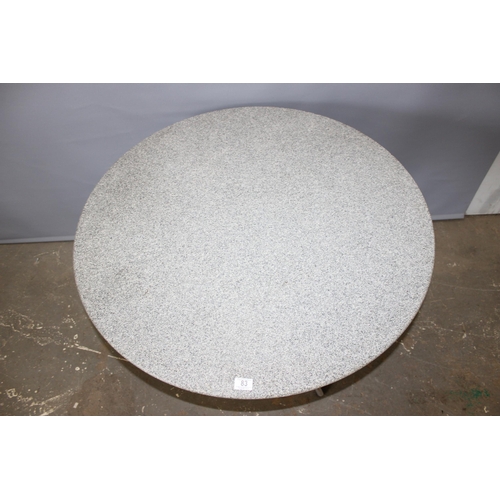 83 - A retro style table with grey marble or granite top and a space age style chrome base, the top appro... 