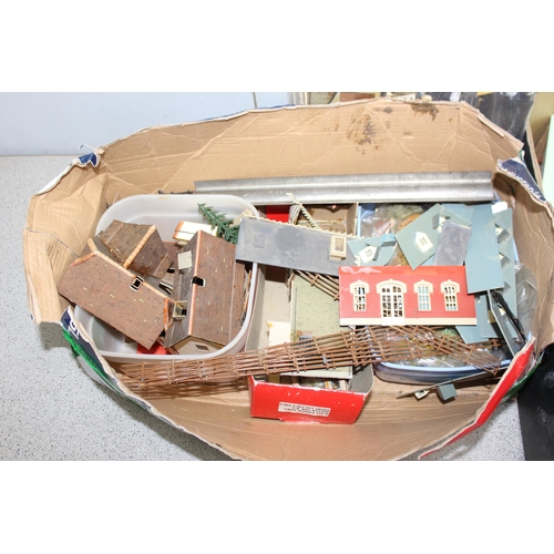 1506 - 2 boxes of assorted model train items to inc rolling stock and buildings/ landscapes etc