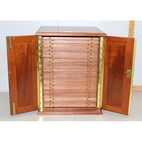 2 - A 20th century oak coin collector's cabinet containing 38 small drawers with turned brass handles an... 