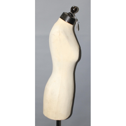 93 - A female form mannequin on wooden base