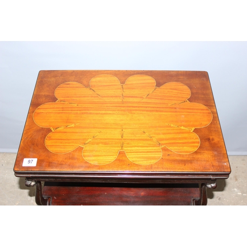 97 - An antique marquetry inlaid card table with fold over top and baize and leather lined interior, appr... 