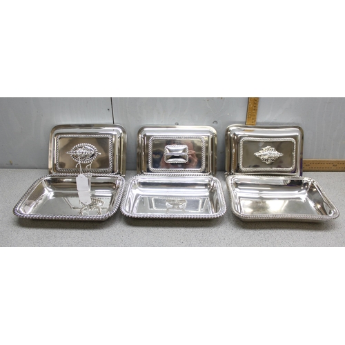 1002 - 3 antique silver plated entrée dishes of rectangular shape with gadrooned borders, one bearing armor... 