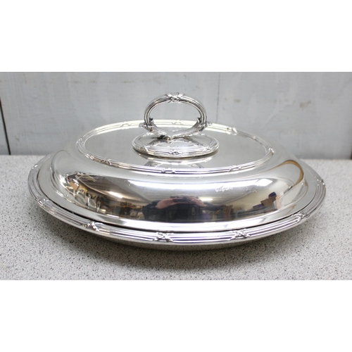 1003 - 2 antique silver plated entrée dishes of oval shape with, the larger approx 29cm wide