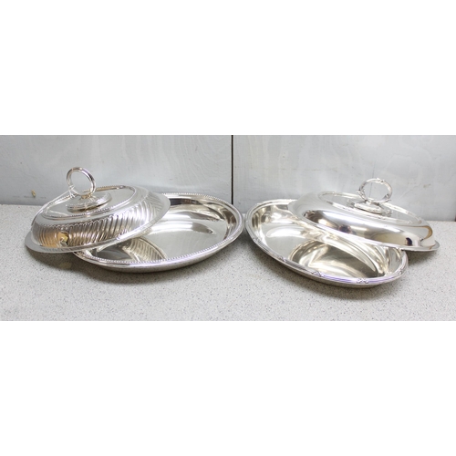 1003 - 2 antique silver plated entrée dishes of oval shape with, the larger approx 29cm wide