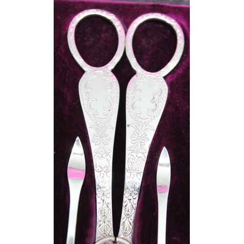 1011 - 4 boxes silver plated items to inc a set of grape scissors and nut picks and crackers, a cruet set a... 