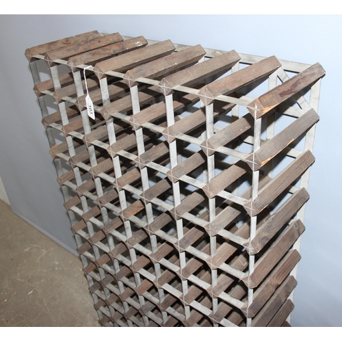 103 - 4 x wine racks, largest holds 84 bottles (approx 120cm tall), other 3 each hold 25 bottles