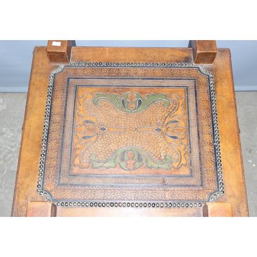 104 - A vintage Asian tooled leather topped side table, approx length 55cm