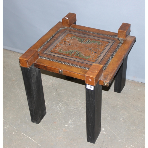 104 - A vintage Asian tooled leather topped side table, approx length 55cm