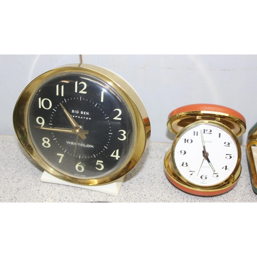 1302 - 13 folding travel clocks and a retro alarm clock. makers to include Coral and Junghans (14)