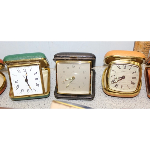 1302 - 13 folding travel clocks and a retro alarm clock. makers to include Coral and Junghans (14)