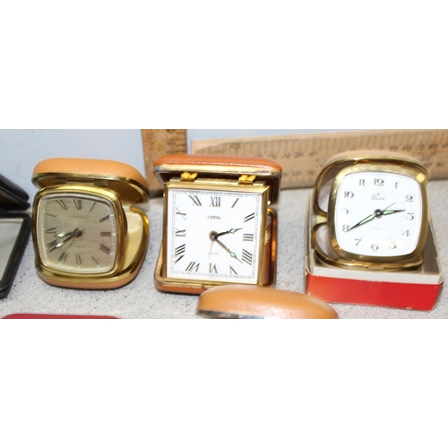 1302 - 13 folding travel clocks and a retro alarm clock. makers to include Coral and Junghans (14)