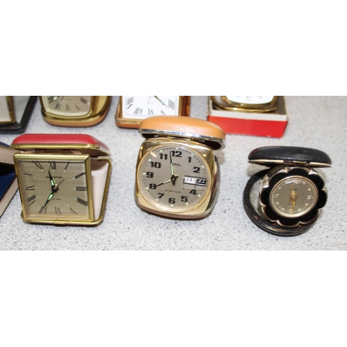 1302 - 13 folding travel clocks and a retro alarm clock. makers to include Coral and Junghans (14)