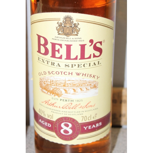 1608 - 3 bottles of Bells 8 year old scotch whisky