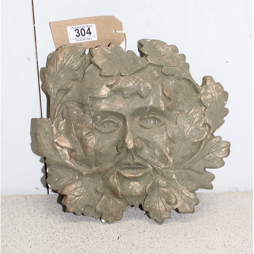 304 - A painted garden green man wall plaque, approx 27cm wide