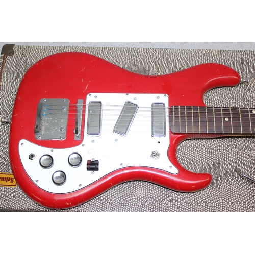 651 - A vintage Watkins Rapier electric guitar with red painted body, in vintage Selmer hardshell guitar c... 