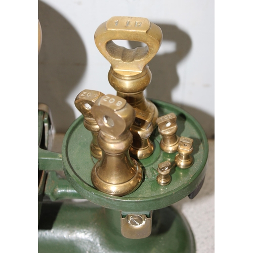 701 - Cast iron set of balance scales by Victor of England and a graduated set of weights