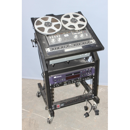 A Revox A77 reel to reel tape recorder mounted into a wheeled
