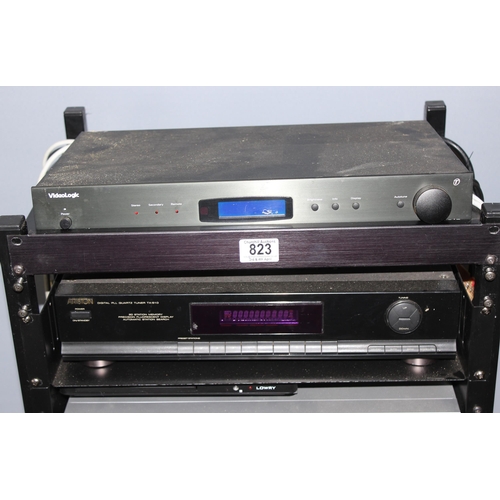 823 - Electronics on stacking stand to include a Videologic DRX-601E DAB Digital Radio Tuner, Ariston TX-5... 