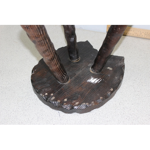 123 - An interesting stained pine 3 legged milking stool with carved horseshoe detail to the seat