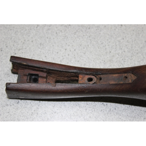 1404 - Four vintage wooden rifle gun stocks – two with incised cross hatching