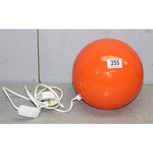 255 - Retro style orange glass globe table lamp.