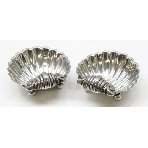 1018 - A pair of silver shell shaped salts, Birmingham 1894 makers mark obscured, approx 36.48g gross