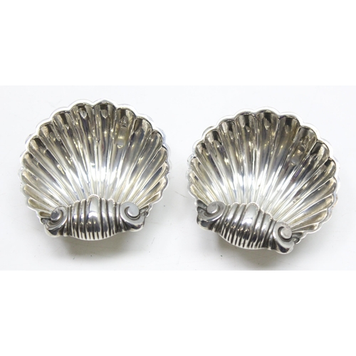 1018 - A pair of silver shell shaped salts, Birmingham 1894 makers mark obscured, approx 36.48g gross