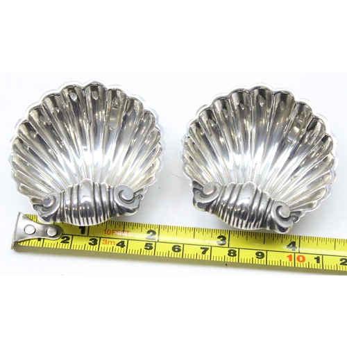 1018 - A pair of silver shell shaped salts, Birmingham 1894 makers mark obscured, approx 36.48g gross