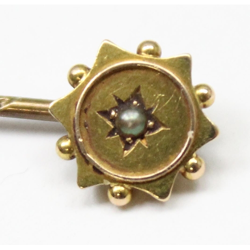 1100 - A 19th century 18ct gold stick pin with seed pearl to the centre, XRF tested that top is 18ct, pin i... 