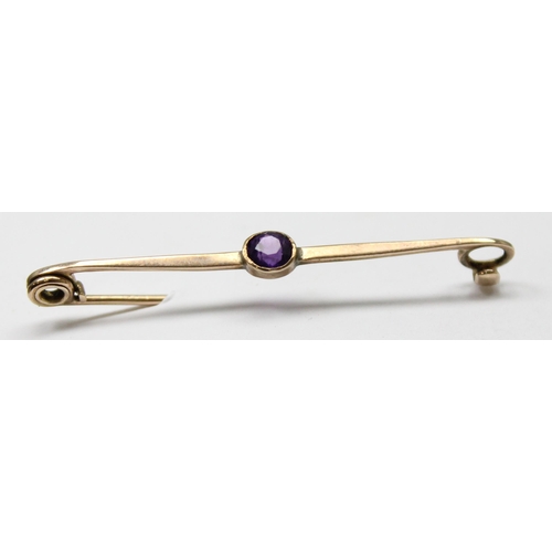 1111 - 9ct gold brooch set with purple stone, approx 1.17g gross, approx 4cm