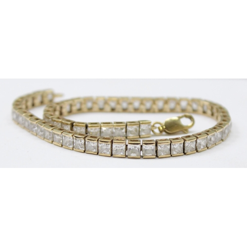 1114 - 9ct gold tennis bracelet set with square cut white stones, gross weight approx 11.23g, 20cm