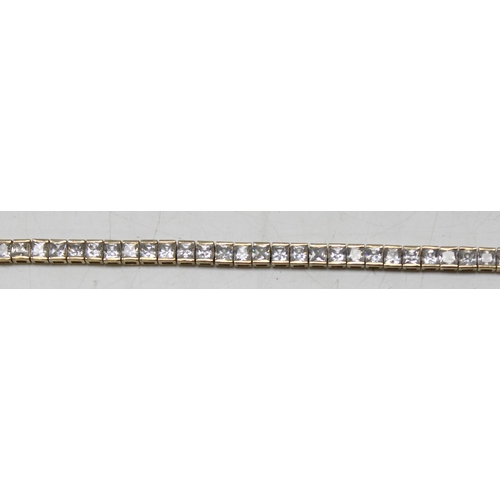 1114 - 9ct gold tennis bracelet set with square cut white stones, gross weight approx 11.23g, 20cm