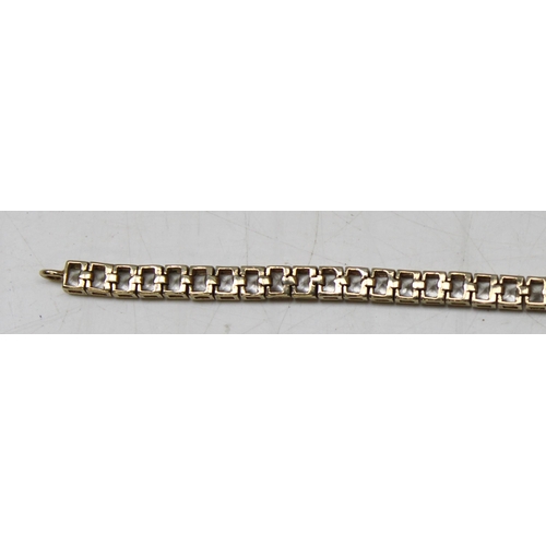 1114 - 9ct gold tennis bracelet set with square cut white stones, gross weight approx 11.23g, 20cm