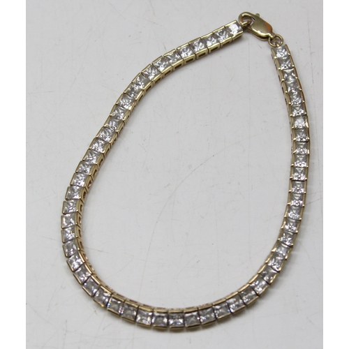 1114 - 9ct gold tennis bracelet set with square cut white stones, gross weight approx 11.23g, 20cm