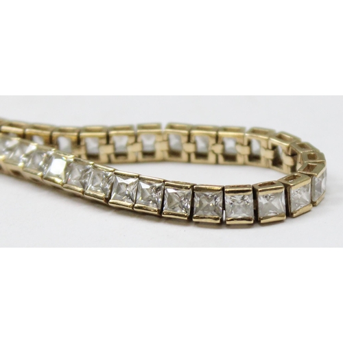 1114 - 9ct gold tennis bracelet set with square cut white stones, gross weight approx 11.23g, 20cm