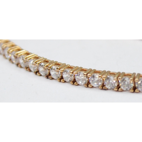 1114A - A 925 silver gilt and white stone set tennis bracelet