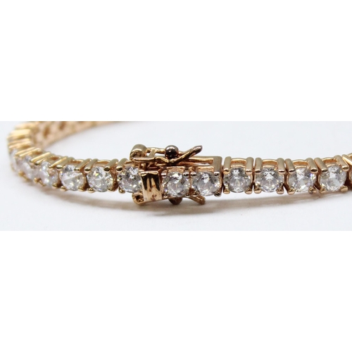 1114A - A 925 silver gilt and white stone set tennis bracelet