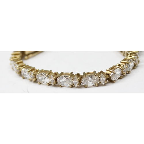 1116 - 9ct gold tennis bracelet set with white stones, approx 15.01g gross, 20cm