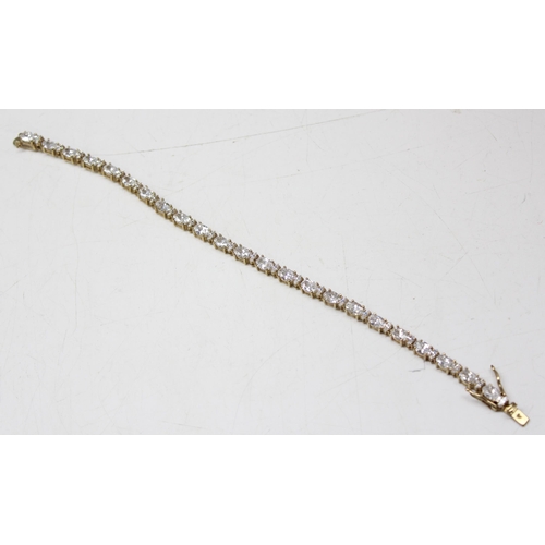 1116 - 9ct gold tennis bracelet set with white stones, approx 15.01g gross, 20cm