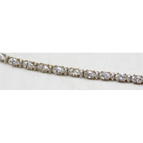 1116 - 9ct gold tennis bracelet set with white stones, approx 15.01g gross, 20cm