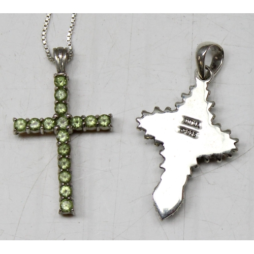 1130 - 4 silver pendants, 3 on chains to include 3 crucifixes and another gothic style pendant set with col... 